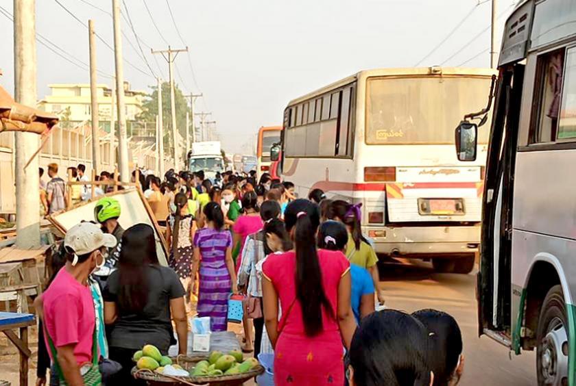 Workers seen preparing to go to work at a factory.