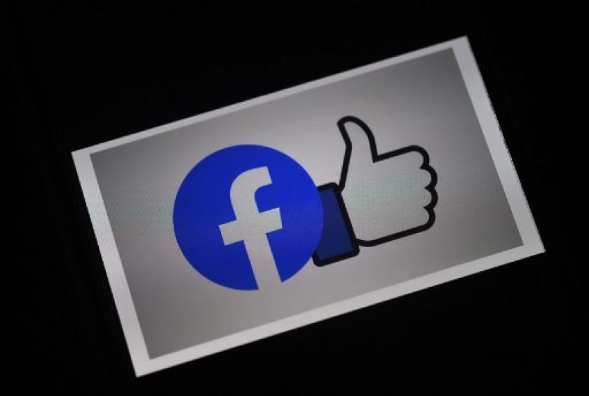 The Facebook App logo is displayed on a smartphone in Arlington, Virginia, in a file photograph taken on March 25, 2020. (AFP/Olivier Douliery )  