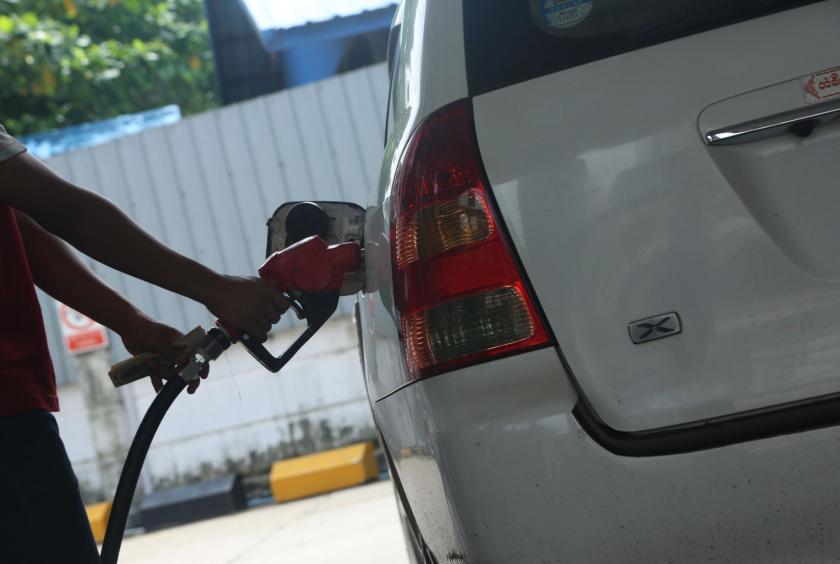 The photo shows a fuel station in Yangon. 