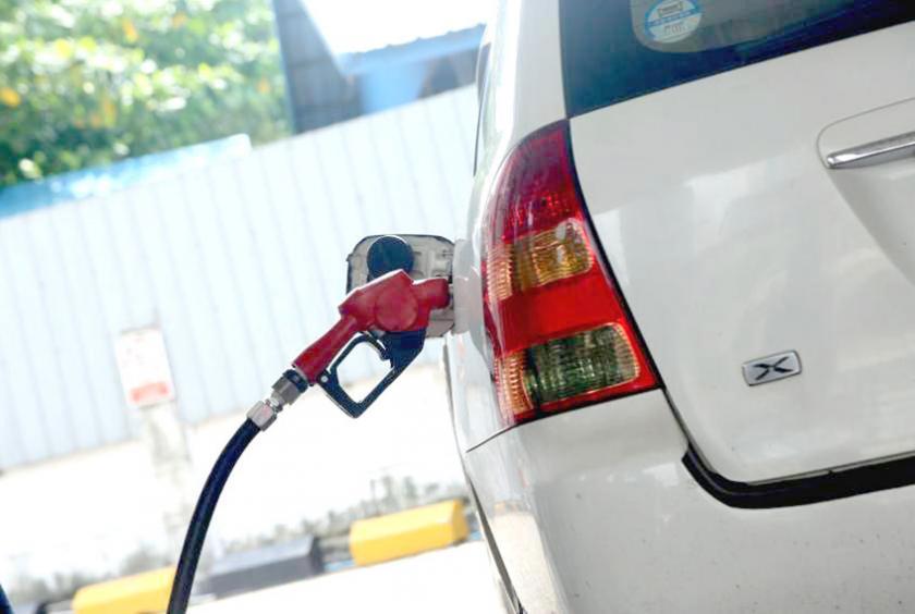 A car being filled up at a fuel station in Yangon. 