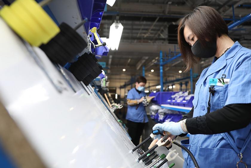 A technician works on the production line of a car component manufacturer in Anshan, Liaoning province. [Photo/Xinhua]