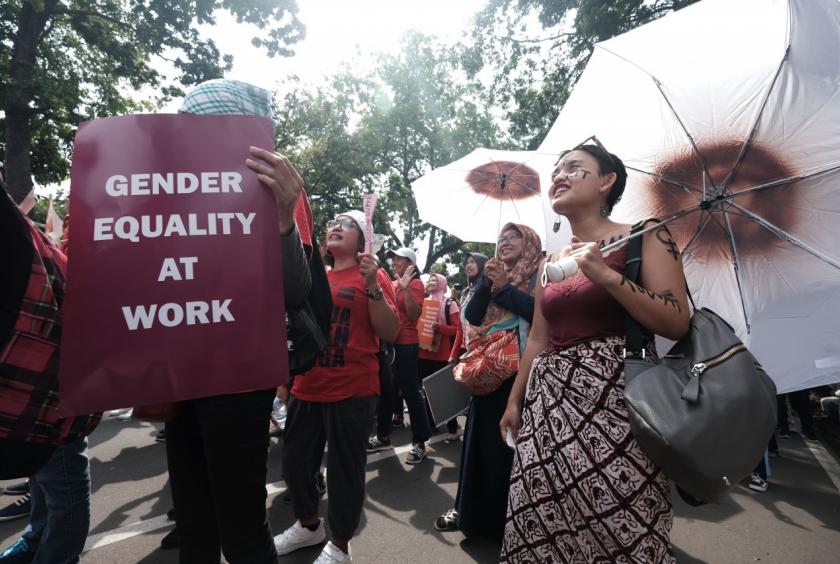 Women demand gender equality at work during a protest in front of the Presidential Palace on Dec. 22. (JP/Donny Fernando)