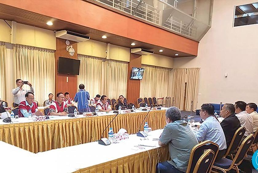 The government peace negotiators of NRPC meet the KNU representatives in Yangon on July 9.