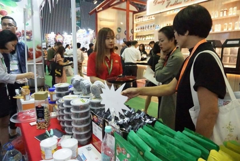 Visitors at the VietFood, Beverage and Professional Packing Machines international exhibition that opened in HCM City on August 7. — VNS Photo Thu Hang