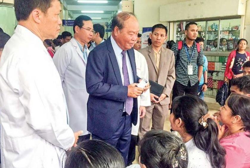 Health Minister Mam Bun Heng conducts an inspection of the innovative web-based hospital operating management system, Peth Yoeung, at Preah Ang Duong Hospital in Phnom Penh on Thursday. LONG KIMMARITA