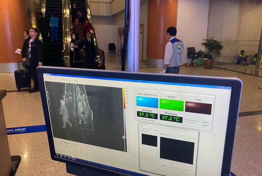 Travellers take screening tests at Yangon International Airport. 