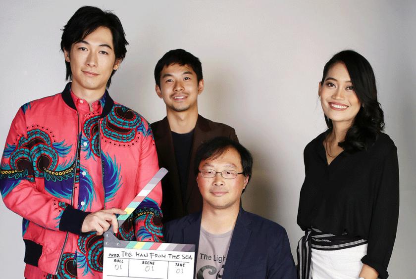 Cultural mix: The Man from the Sea' director Koji Fukada (seated) poses with Japanese actors Dean Fujioka (left) and Taiga (second left), and Indonesian actress Sekar Sari during their visit to The Jakarta Post offices on Dec. 17, 2018. (The Jakarta Post/Wienda Parwitasari )