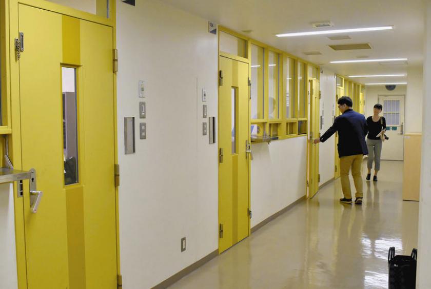 Doors to detainee rooms at the Higashi-Nihon Immigration Center in Ushiku, Ibaraki Prefecture