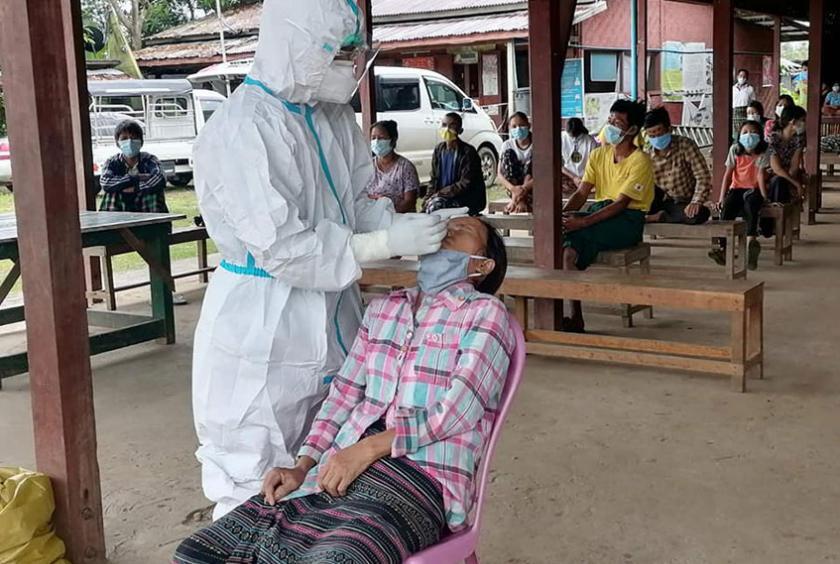 Swab tests are conducted at Waimaw-Mongna KBC refugee camp, which can house about 3,000 war refugees, on July 31.