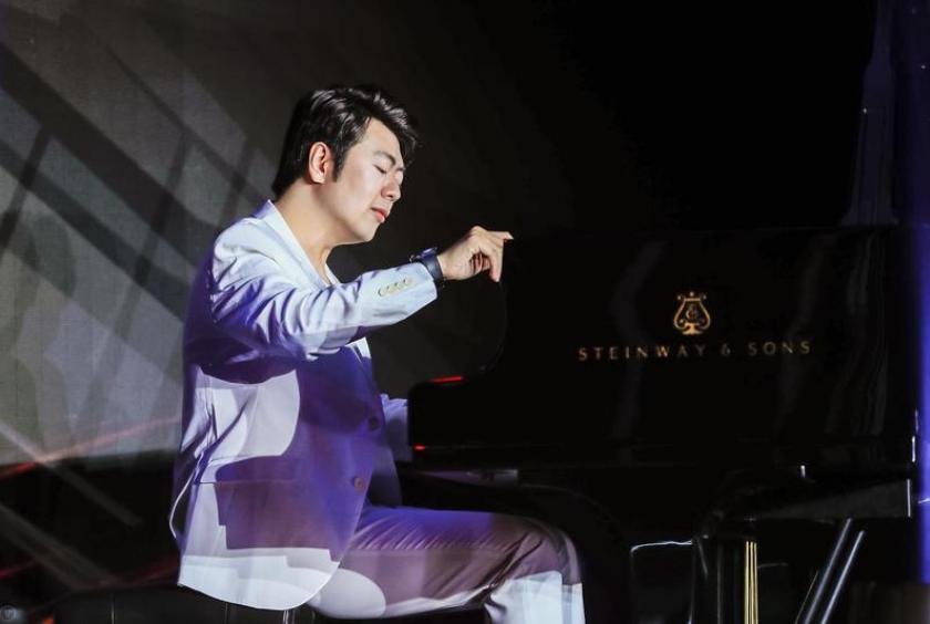 Chinese pianist Lang Lang performs music during the shooting of