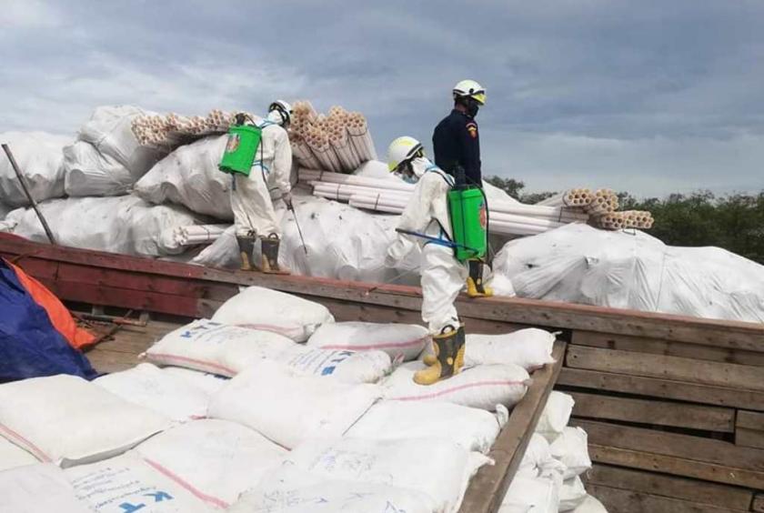 Vessels with cargos are being sprayed at the jetty of Maungdaw border trade (Photo-Rakhine Fire Force)