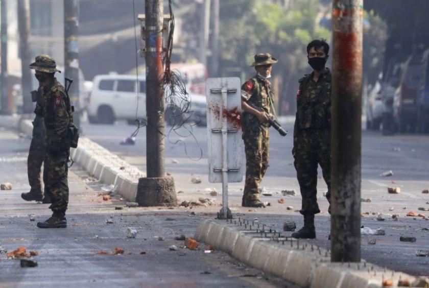 Armed troops deployed on a road in Yangon, Myanmar, March 31, 2021.PHOTO: EPA-EFE