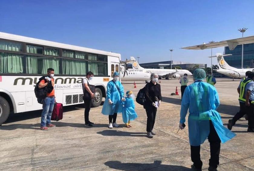 Passengers seen at Yangon Airport before leaving by MNA flight