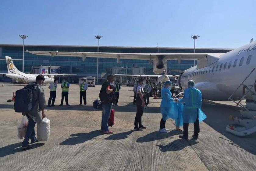Passengers seen before boarding on MNA plane