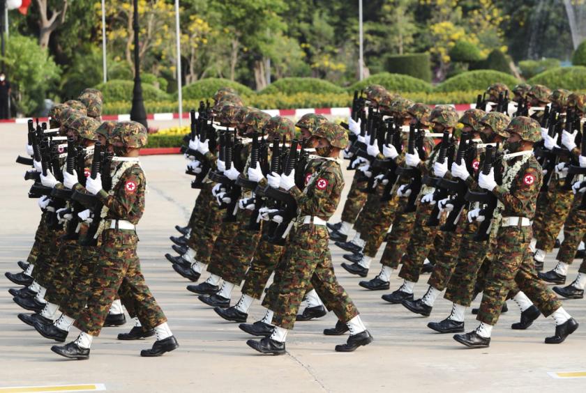 Members of the Myanmar military march during a parade to commemorate Myanmar's 77th Armed Forces Day in Naypyitaw, Myanmar, Sunday, March 27, 2022. - AP