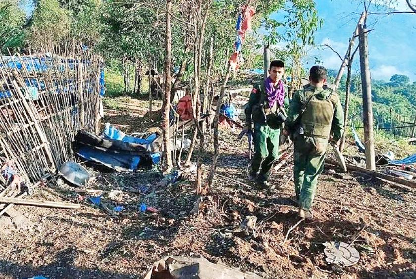 Members of the Myanmar National Democratic Alliance Army walking past a Myanmar military base in Shan state.  PHOTO: THE STRAITS TIMES