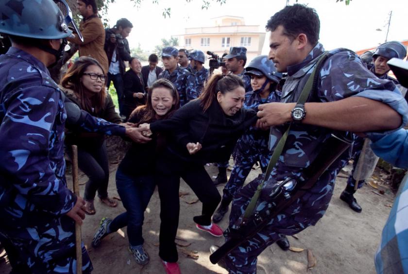 In this 2011 file photo, police detain exiled Tibetan protestors during an anti-China protest rally in Kathmandu. Post FIle