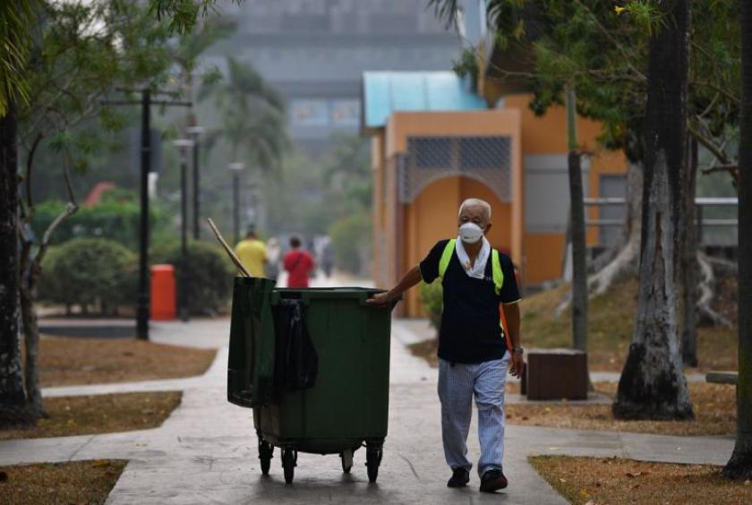 Cleaner Ng Siew Chuan, 78, clearing rubbish at Tampines Central Park at 8.47am, on Sept 18, 2019.ST PHOTO: LIM YAOHUI