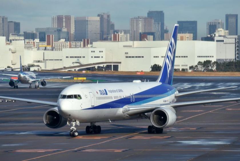 A Japanese government-chartered plane carrying Japanese nationals from Wuhan arrives at Haneda Airport on Wednesday.
