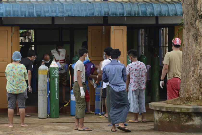 People waiting to refill their oxygen cylinders.