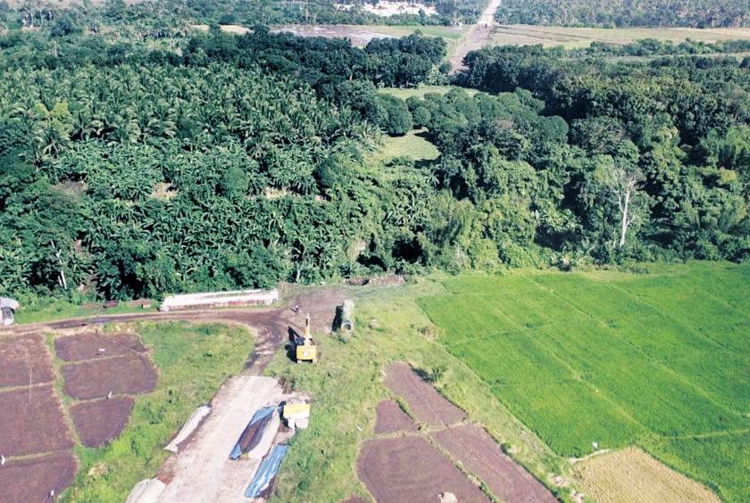 CREEPING PROGRESS A wide expanse of green remains untouched by creeping progress such as this P467-million bypass project in Sariaya town, Quezon province. —DELFIN T. MALLARI JR.  