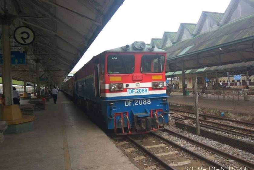 A train is entering Yangon Railway Station. 
