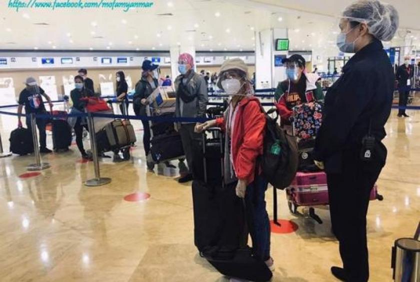 Myanmar citizens arriving back from the Philippines.  