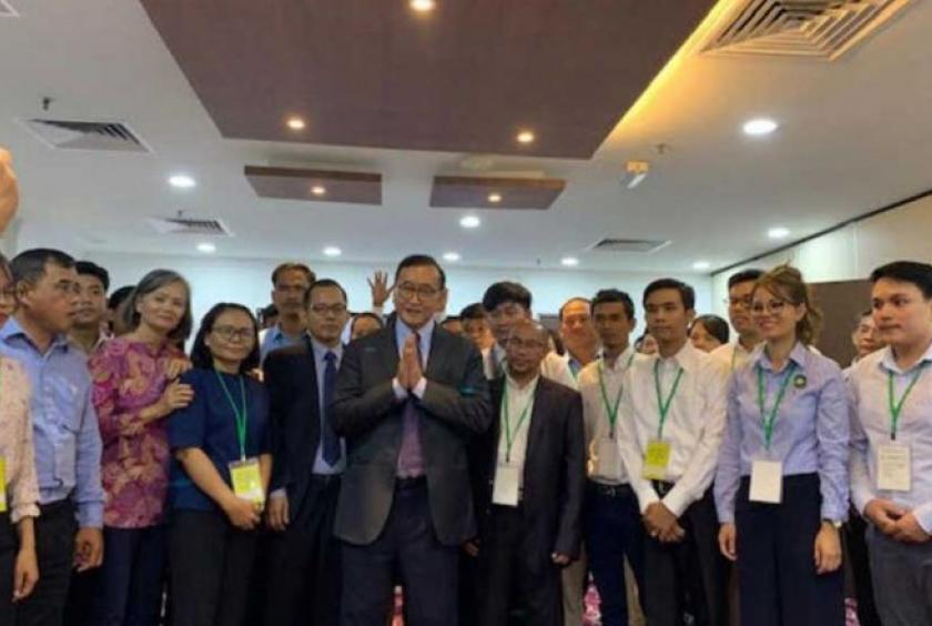 Sam Rainsy (centre) meets supporters in Malaysia on Friday. SAM RAINSY VIA FACEBOOK