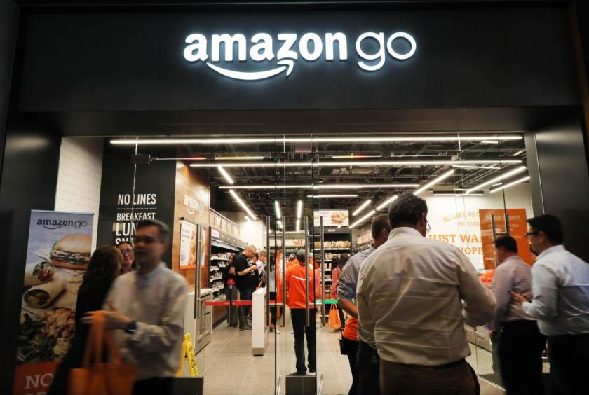 People shop at the newly opened cashier-less Amazon Go Store in New York City on May 7, 2019. (AFP)