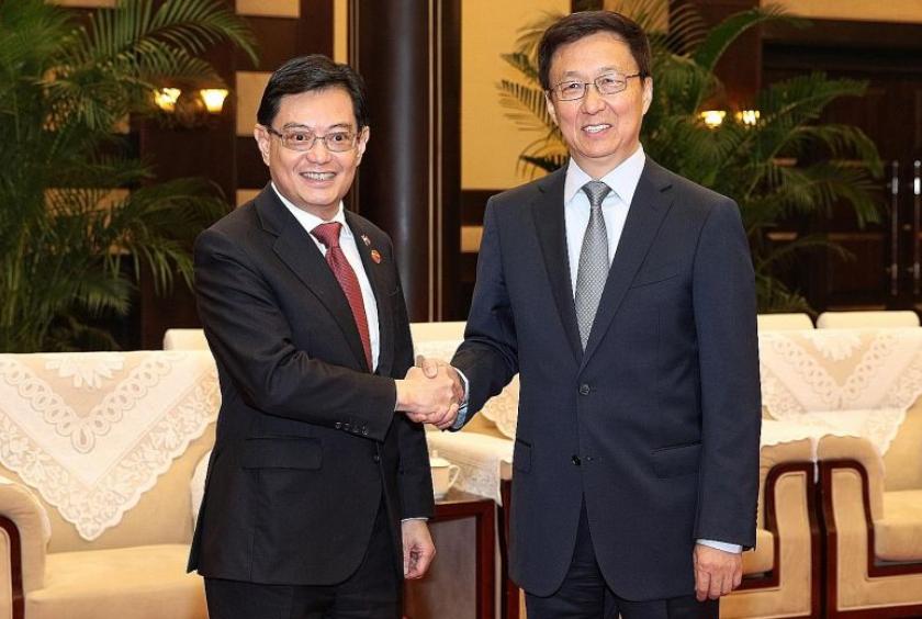 Deputy Prime Minister Heng Swee Keat (left) and Chinese Vice-Premier Han Zheng meeting yesterday in China's south-western city of Chongqing. Singapore and China signed a raft of pacts at the 15th Joint Council for Bilateral Cooperation meeting.PHOTO: MCI