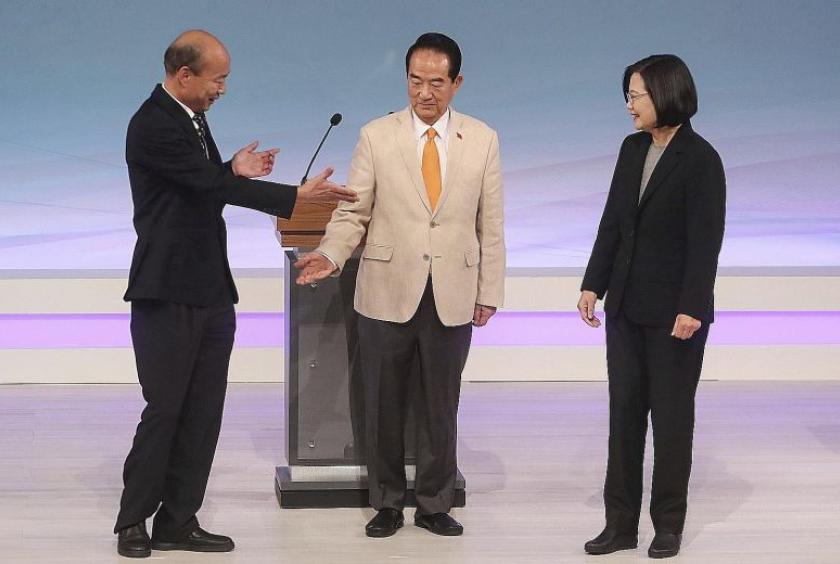 From left: Mr Han Kuo-yu from the Kuomintang, People First Party chairman James Soong and President Tsai Ing-wen of the Democratic Progressive Party before the start of their televised debate in Taipei yesterday. Taiwan will hold its general elections on Jan 11.PHOTO: ASSOCIATED PRESS