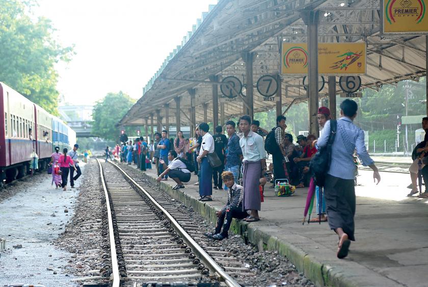 Passengers waiting for a circular train at a railway station