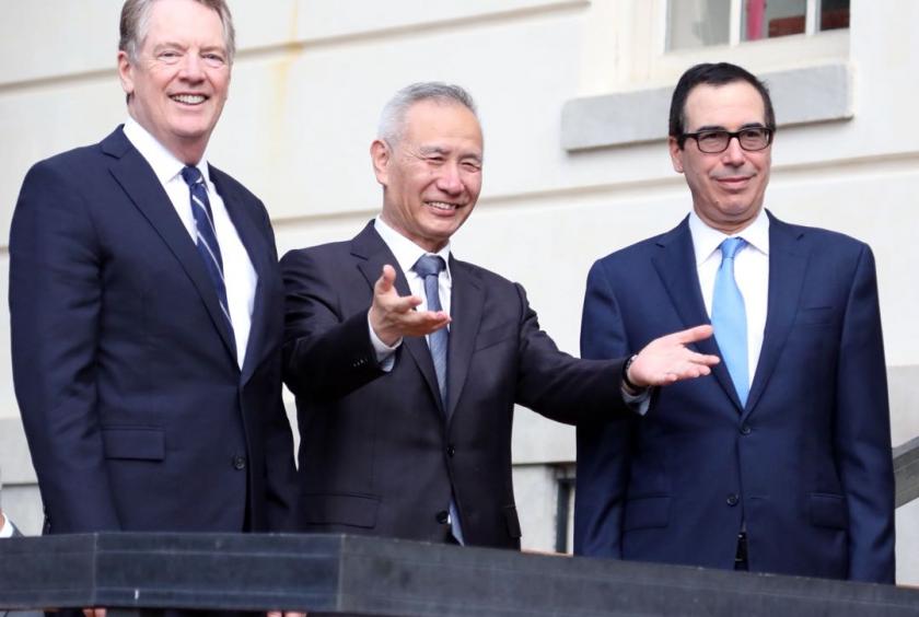 Chinese Vice-Premier Liu He (center) arrives at the headquarters of the Office of the United States Trade Representative, and is welcomed by USTR Robert Lighthizer (left) and Secretary of the Treasury Steven Mnuchin, on Thursday morning. The 13th round of high-level trade negotiations between China and the United States will continue until Friday. [Photo by Zhao Huanxin / China Daily]
