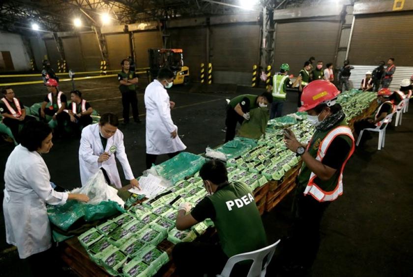 Laboratory technicians examine 276kg of crystal meth at Manila International Container Port on Friday night. — Photo newsinfo.inquirer.net 