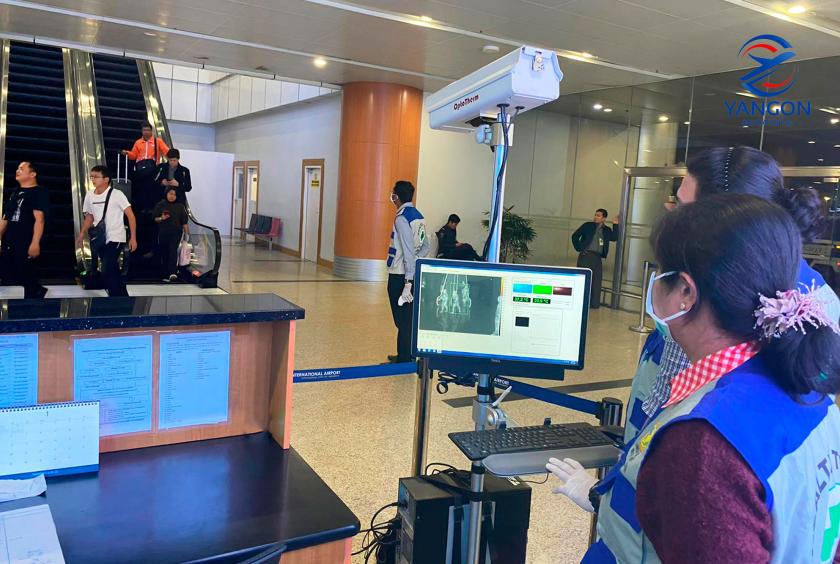 Health staff carry out fever screening tasks at Yangon International Airport 