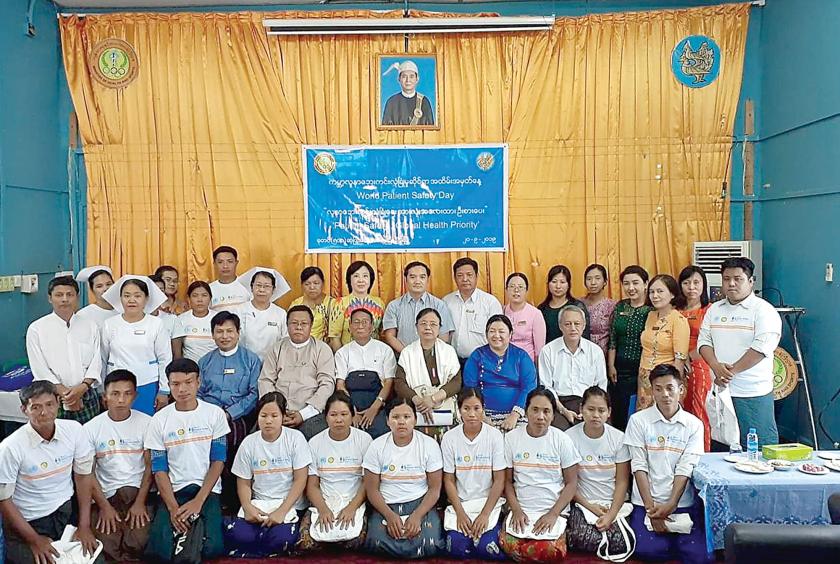 Those attending World Patient Safety Day celebration pose for group photo 