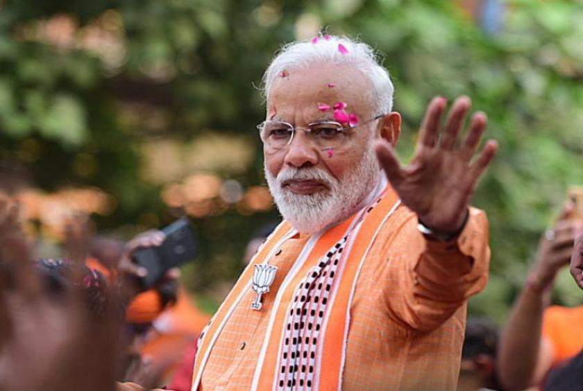 Indian Prime Minister Narendra Modi waves to his supporters during a road show in Varanasi, Uttar Pradesh, India, on April 25, 2019.PHOTO: EPA-EFE
