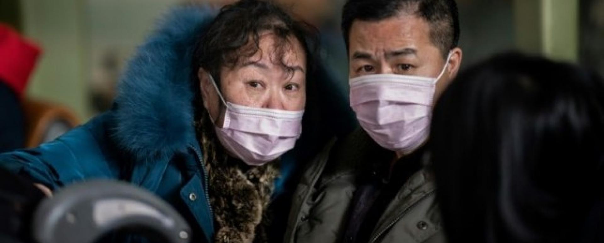   People travelling for the Lunar New Year wear protective masks as they head to the departure area at Beijing Capital International Airport. File Photo: AFP