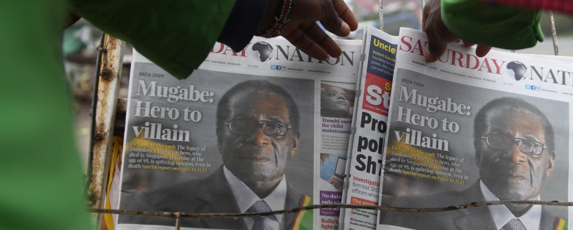 A man buys a daily newspaper at a stand on the streets of Nairobi, on September 7, 2019, following the death of former Zimbabwe president Robert Mugabe, guerrilla hero turned despot who ruled Zimbabwe for 37 years. Mugabe, 95, passed away on September 6, 2019 in Singapore, where he had been hospitalised in April. First heralded as a liberator who rid the former British colony Rhodesia of white minority rule, Mugabe used repression and fear to govern until he was finally ousted by his previously loyal genera