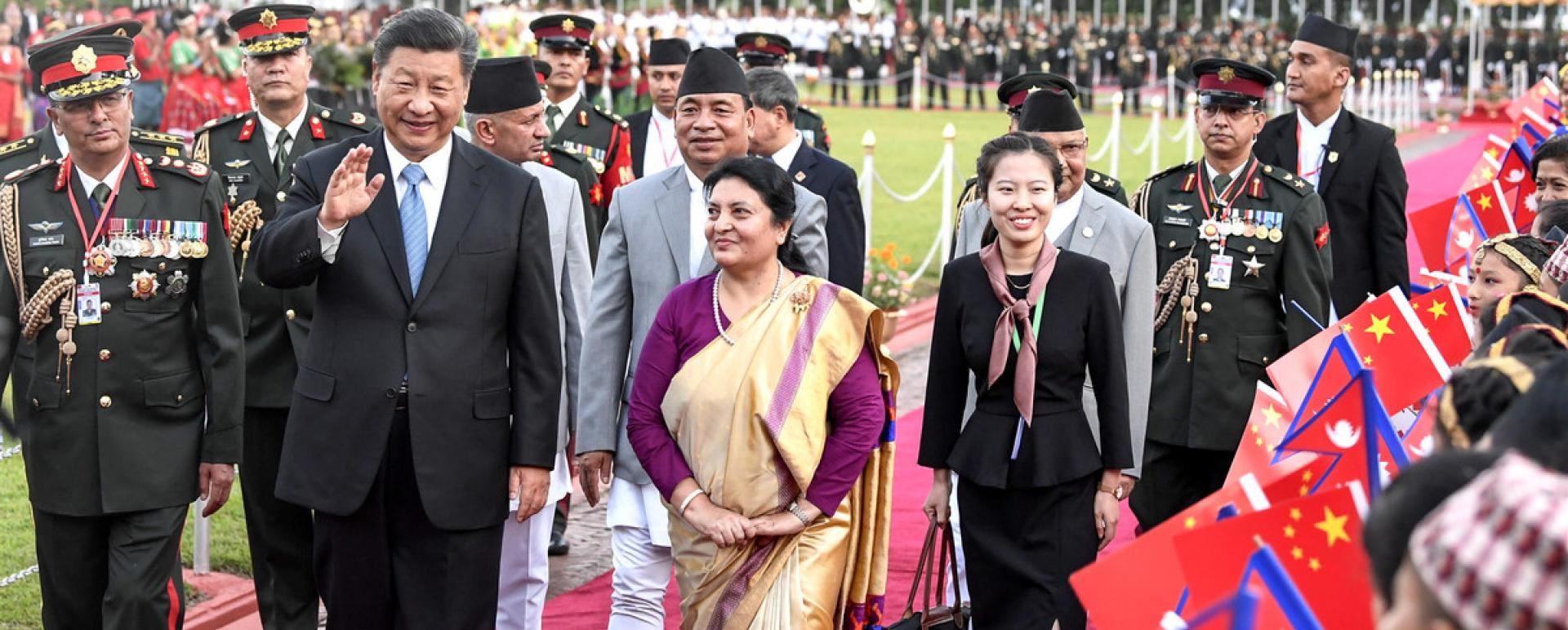President Xi Jinping, accompanied by President Bidya Devi Bhandari of Nepal, greets crowds after arriving in Kathmandu, the country’s capital, on Saturday. Xi’s state visit marks the first by a Chinese president to Nepal in 23 years. [GAO JIE / XINHUA] 