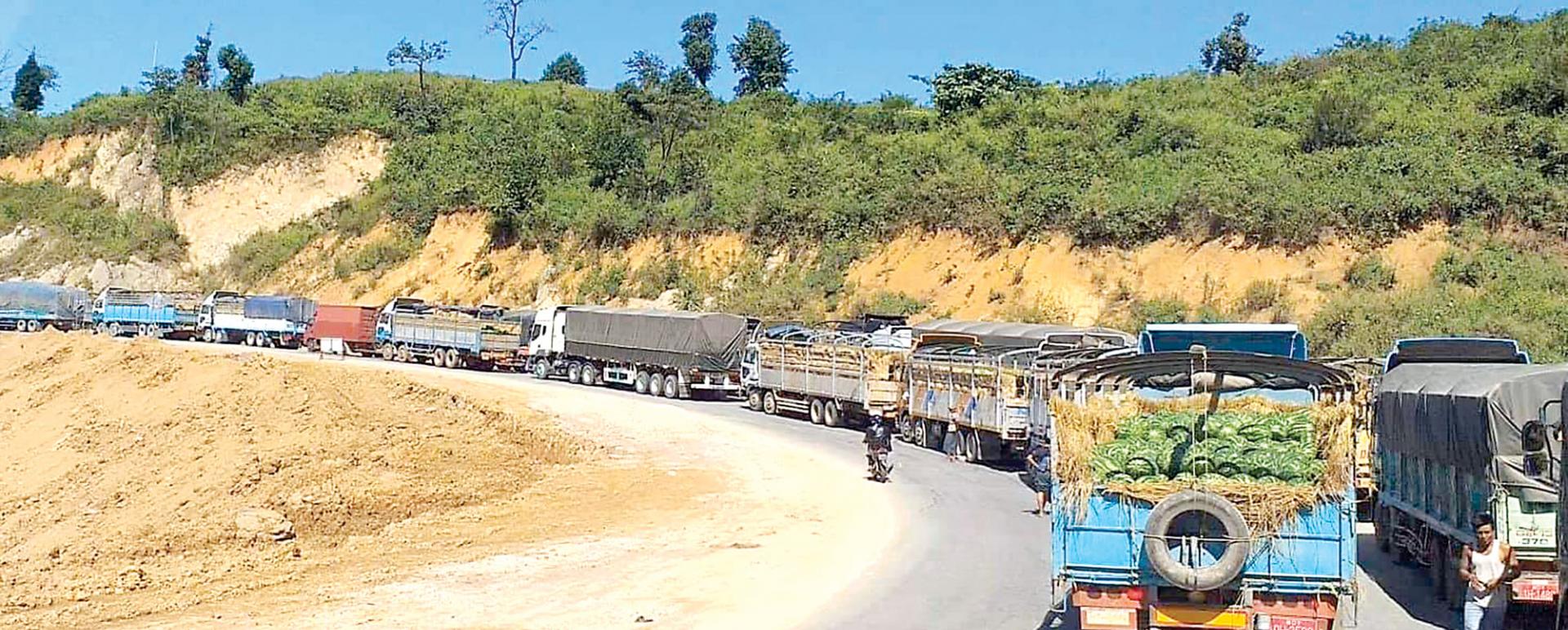 Cargo trucks and passenger buses are in a queue due to the clash between Tatmadaw and TNLA