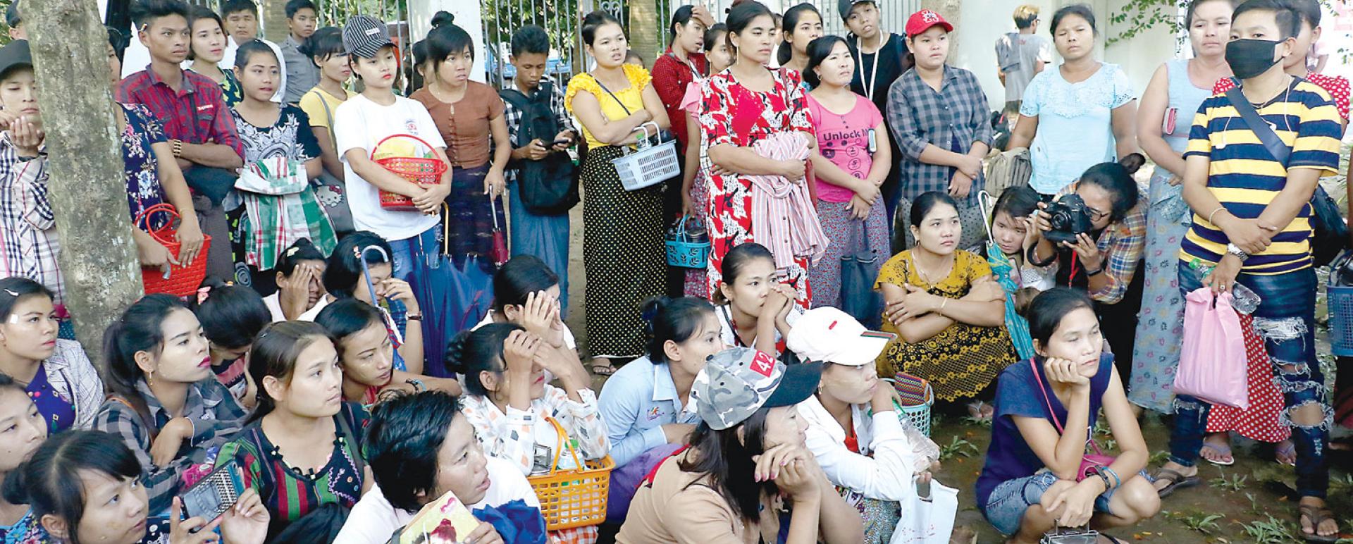 Some workers from five factories seen in front of the Yangon Regional Government Committee’s Office