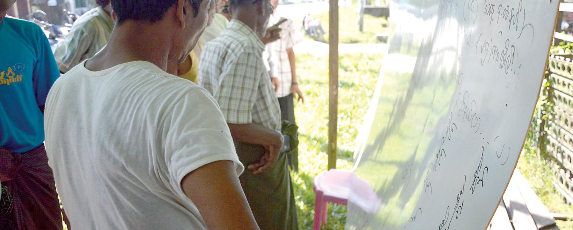 Sittwe residents observe the results of General Election 2015