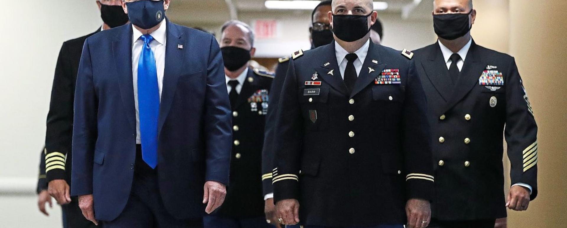 Power before people: Trump visiting Walter Reed National Military Medical Centre in Bethesda, Maryland, earlier this month, wearing a mask for the first time since the Covid-19 outbreak. Wearing a mask in the US has been described as a political issue, not a medical necessity. — AP
