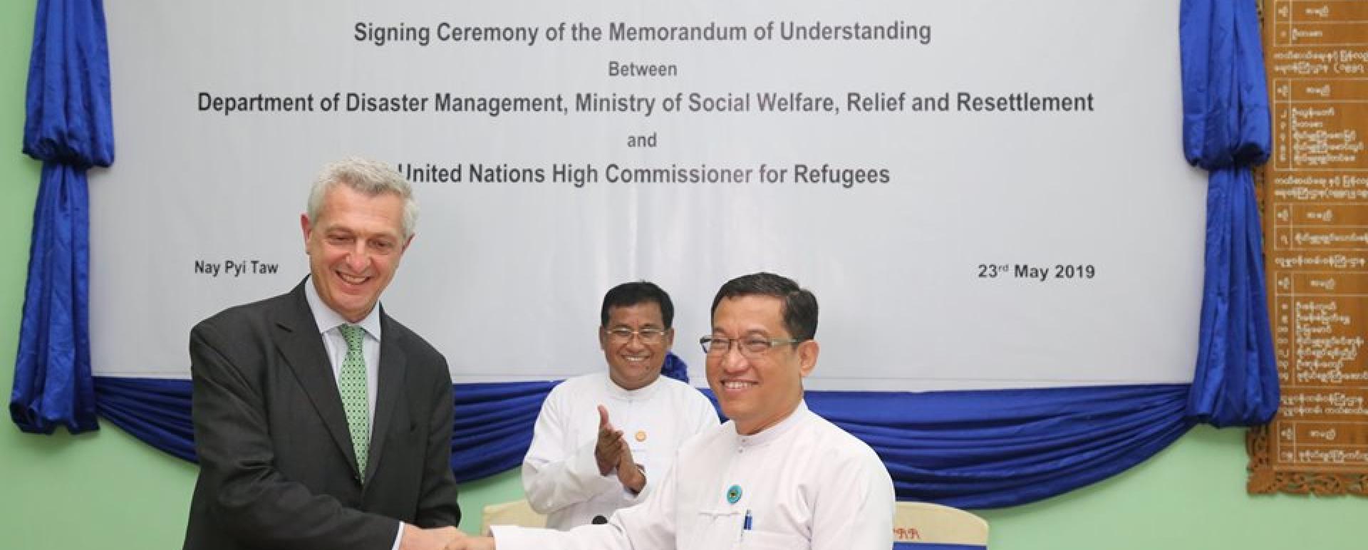 Filippo Grandi, UN High Commissioner for Refugees (left), exchanges the MoU with Dr.Ko Ko Naing, a director general at the Ministry of Social Welfare, Relief and Resettlement, in Nay Pyi Taw (Photo courtesy of Ministry of Social Welfare, Relief and Resettlement)