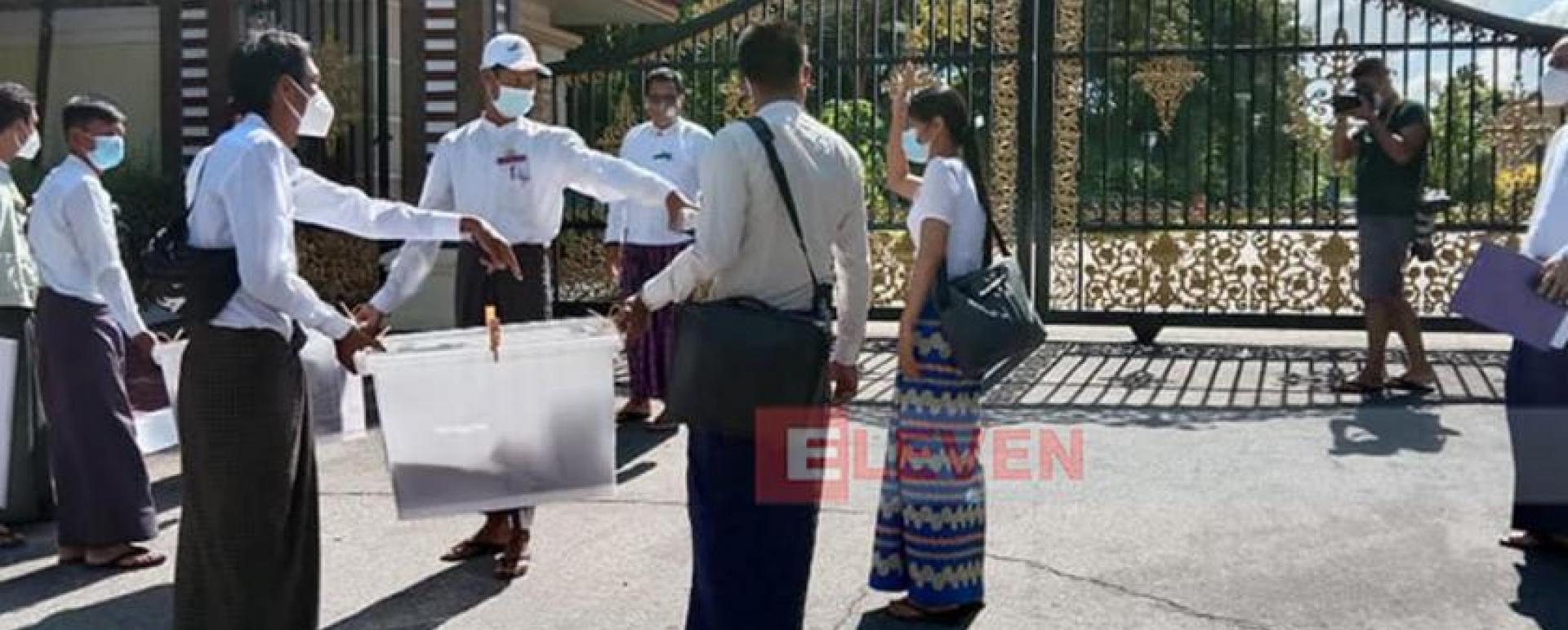 Officials from election commission arrives in front of Retired Senior General Than Shwe’s house in Nay Pyi Taw to collect early ballots (photo-Nay Rai)